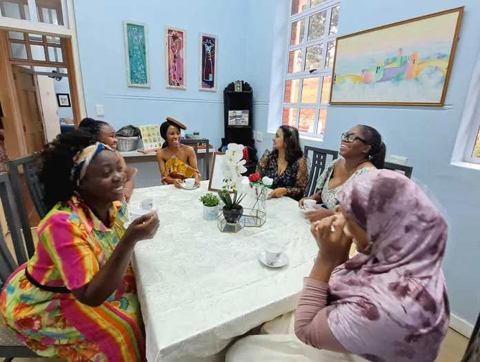 Carers and educators from Action in Autism get dressed up in their annual Women's Wellness Day Fundraiser, Bridgerton Under South African Skies High Tea, taking place on Saturday, 15 August 2026. Image supplied by PR company for Action in Autism.